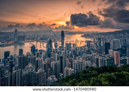 Hong Kong city at sunrise view from Peak mountain.