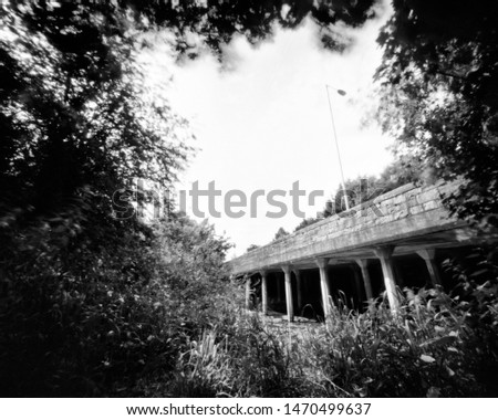bridge and trees in the spring, this black and white camera obscura photo is NOT sharp due to camera characteristic. Taken on analogue photographic large  format negative film with a pinhole camera.