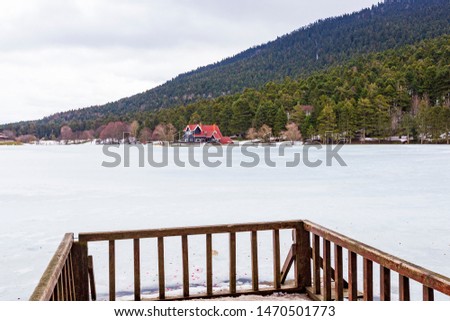 Bolu Golcuk National Park, lake wooden house on a snowy winter day in the forest in Turkey
