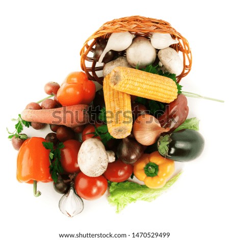 closeup.mushrooms and a variety of fresh vegetables in a wicker basket.