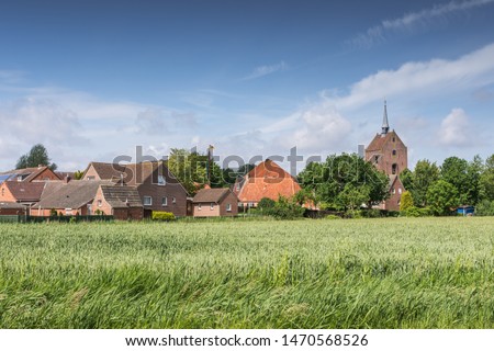 View at Groothusen, a typical "Langwurtendorf" in East Frisia, Germany Royalty-Free Stock Photo #1470568526