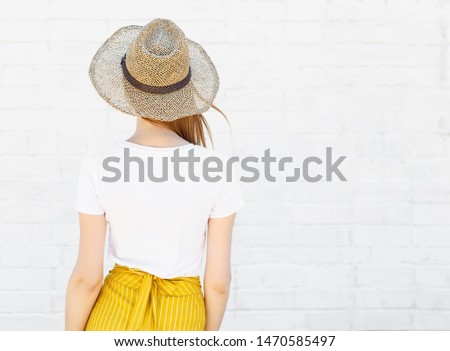 T-shirt design, people concept - closeup of young woman in hat in blank white t-shirt and a bright orange skirt, front isolated. Mockup square.