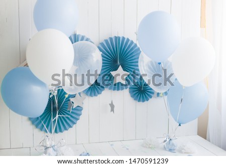 children's holiday. the first day of birth. inflatable balls of blue and white color