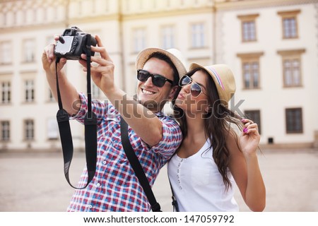 Happy tourists taking photo of themselves