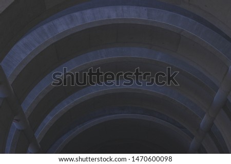 Curved concrete lines inside a parking house