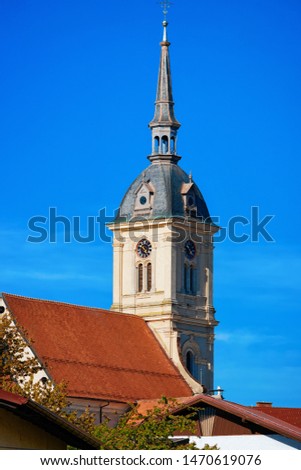 Belfry of Saint Bartholomew Parish Church in Old center in Slovenska Bistrica near Maribor in Slovenia. City travel in South Styria in Slovenija. Bell tower of Cathedral in Slovenian town.