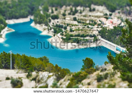 Beautiful view of the blue water reservoir, mountains and river near the castle of Guadalest in Alicante province, Spain.