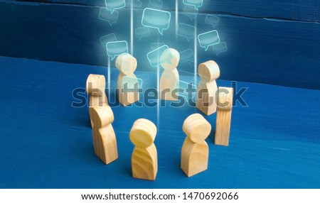 Speech clouds in the center of a people circle. Discussion processes in a team or community. Share opinion, diplomacy. Collaboration and cooperation, participation in a meeting. Business negotiations. Royalty-Free Stock Photo #1470692066