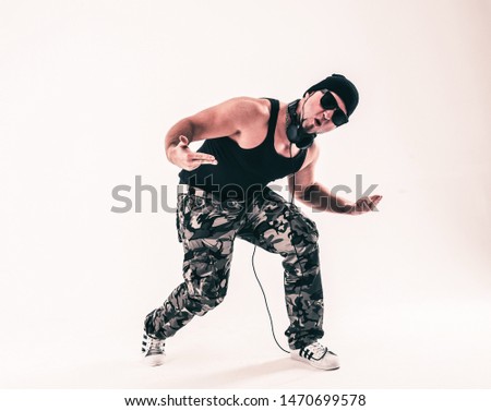 best rapper dancing break dance. photo on a light background. the photo has a empty space for your text