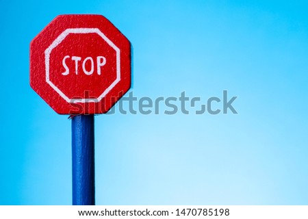 road signal STOP - isolated on blue background