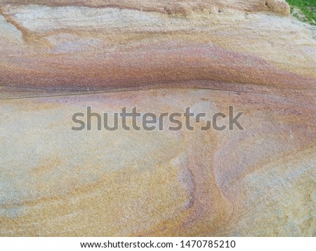The texture of the stone is large. Colorful stones from the coast.
