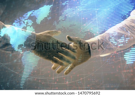 Multi exposure of world map on abstract background with two businessmen handshake. Concept of international business