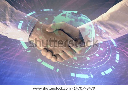 Multi exposure of world map on abstract background with two businessmen handshake. Concept of international business