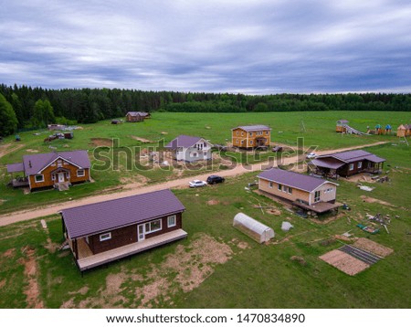 new village on the field near the forest