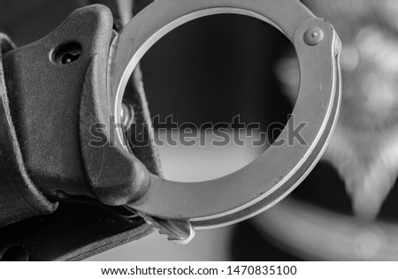 UK Police handcuffs in black and white.