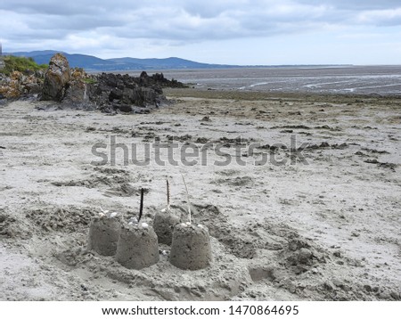Sand castles on Blackrock Beach in Dundalk, County Louth with the Cooley Mountains in the distant background. 