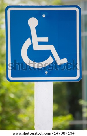 Blue wheelchair sign on the post