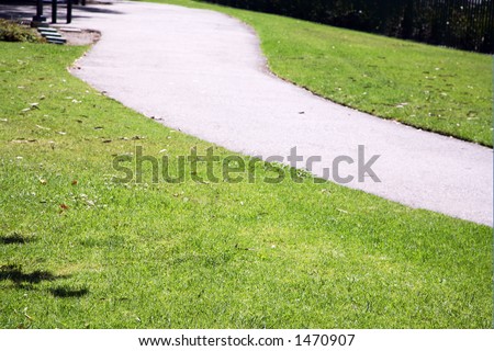 Winding sidewalk through a park