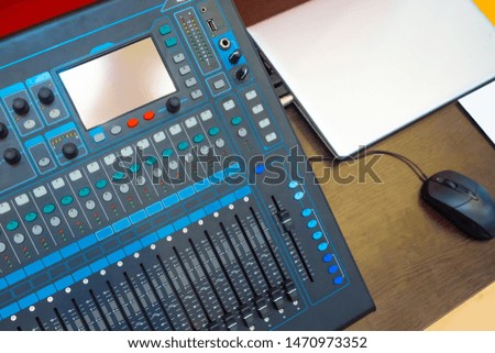 Equipment for conferences. The mixing console is connected to the computer. Sound equipment for seminars. The mixer is connected to a laptop. Organization of press conferences. Music processing