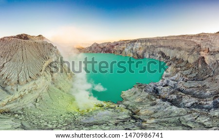 Aerial shot of the Ijen volcano or Kawah Ijen on the Indonesian language. Famous volcano containing the biggest in the world acid lake and sulfur mining spot at the place where volcanic gasses come
