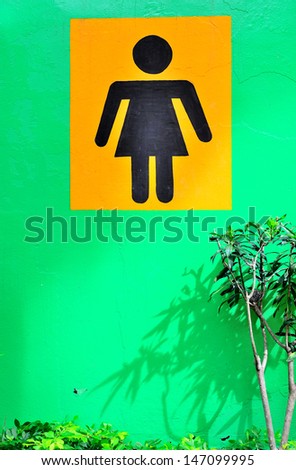 A women restroom sign in national park background