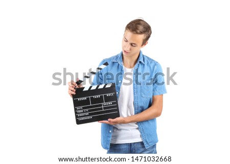 Young man with clapper board isolated on white background