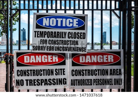 Signs of forbidden to pass and danger for construction works in New York Harbor, Manhattan, New York City, USA