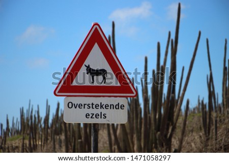 Road sign beware of crossing donkeys