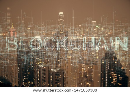 Multi exposure of cryptocurrency theme hologram drawing and city veiw background. Concept of blockchain and bitcoin.