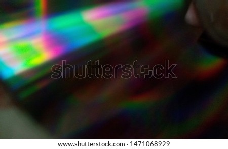 Background from blurry rainbow spots. Smooth transitions from one color to another, from dark to light.