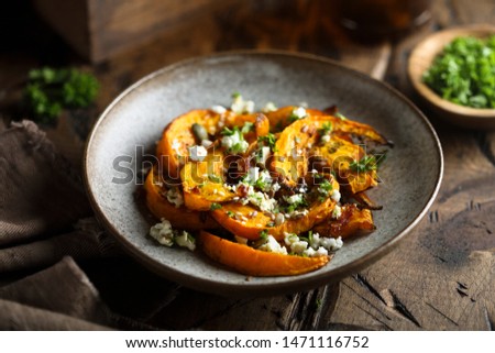 Roasted pumpkin with cheese and herbs