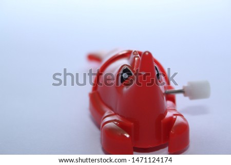 tiny colorful toy on white backdrop