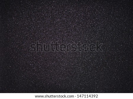 Texture of black foam with glitter
