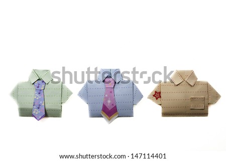 Origami paper folded shirts isolated on white with copy space.