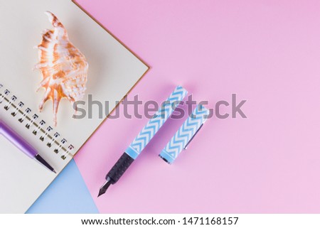 Back to school concept. School stationery and seashell on pink blue background. Pens, pencil and gon on pastel background. Top view. Copy space