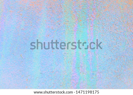 Pearl and opal streaky pattern of luminous rainbow colors.