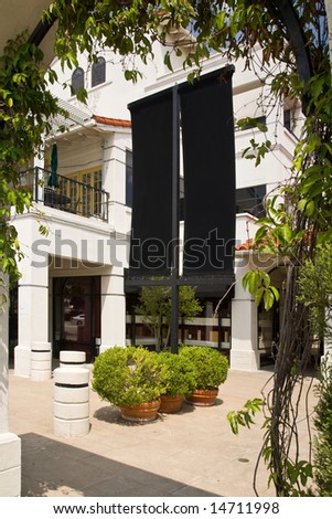 Shopping center with black blank sign age for customization