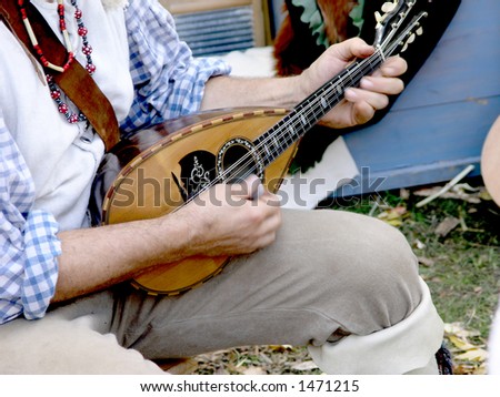 Strumming the mandolin in open air setting