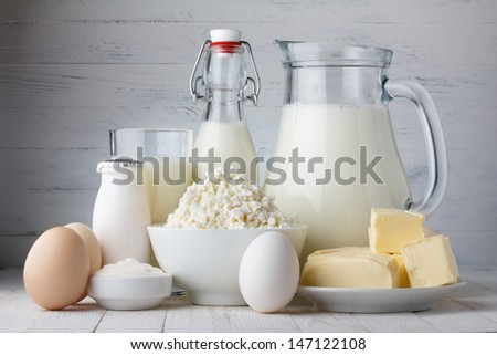 Dairy products on wooden table Royalty-Free Stock Photo #147122108