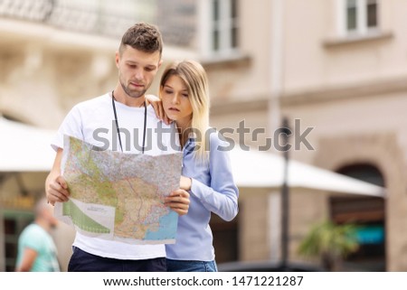 Travel. Tourist Couple Traveling, Walking On Street. Portrait Of Beautiful Young Woman And Handsome Man In Stylish Clothes Sightseeing City Attractions, Looking At Architecture. High Resolution.
