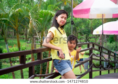 Portrait of beautiful young girl in the garden