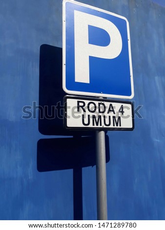 Close up isolated blue Parking sign for four wheel in blue background