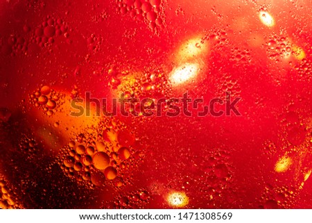 Abstract background with colorful gradient colors. Oil drops in water abstract psychedelic pattern image. Red colored abstract pattern