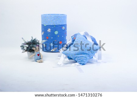 textiles for newborns in the photo Studio on a white background, the side of the pillow in a baby bed, blankets are transformed into envelopes for a walk, a cocoon for a comfortable and safe sleep of 