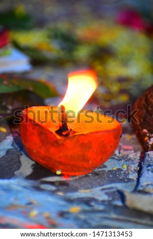 beautiful picture of a diya in lava red colour