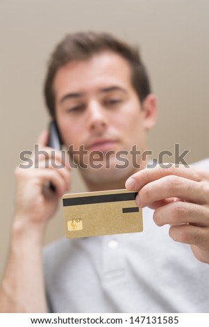 Man paying with credit card on phone