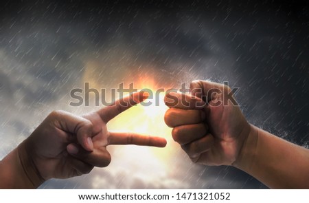 Concept trade competition,trade and economic war, conflict tax business and finance,with hands showing rock paper scissors game,gesture, background glowing light,overcast sky, rain and thunderstorm