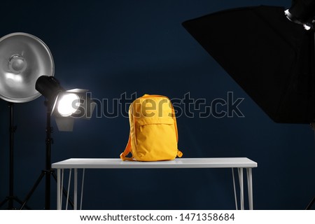 Shooting of bright backpack for product promotion in photo studio