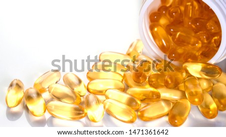 Fish oil capsules with omega 3 and vitamin D in white bottle on isolated on white background,varies benefits supplement and support heart health,healthy diet concept, selective focus