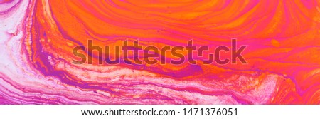 photography of abstract marbleized effect background. red, pink, orange and white creative colors. Beautiful paint. banner